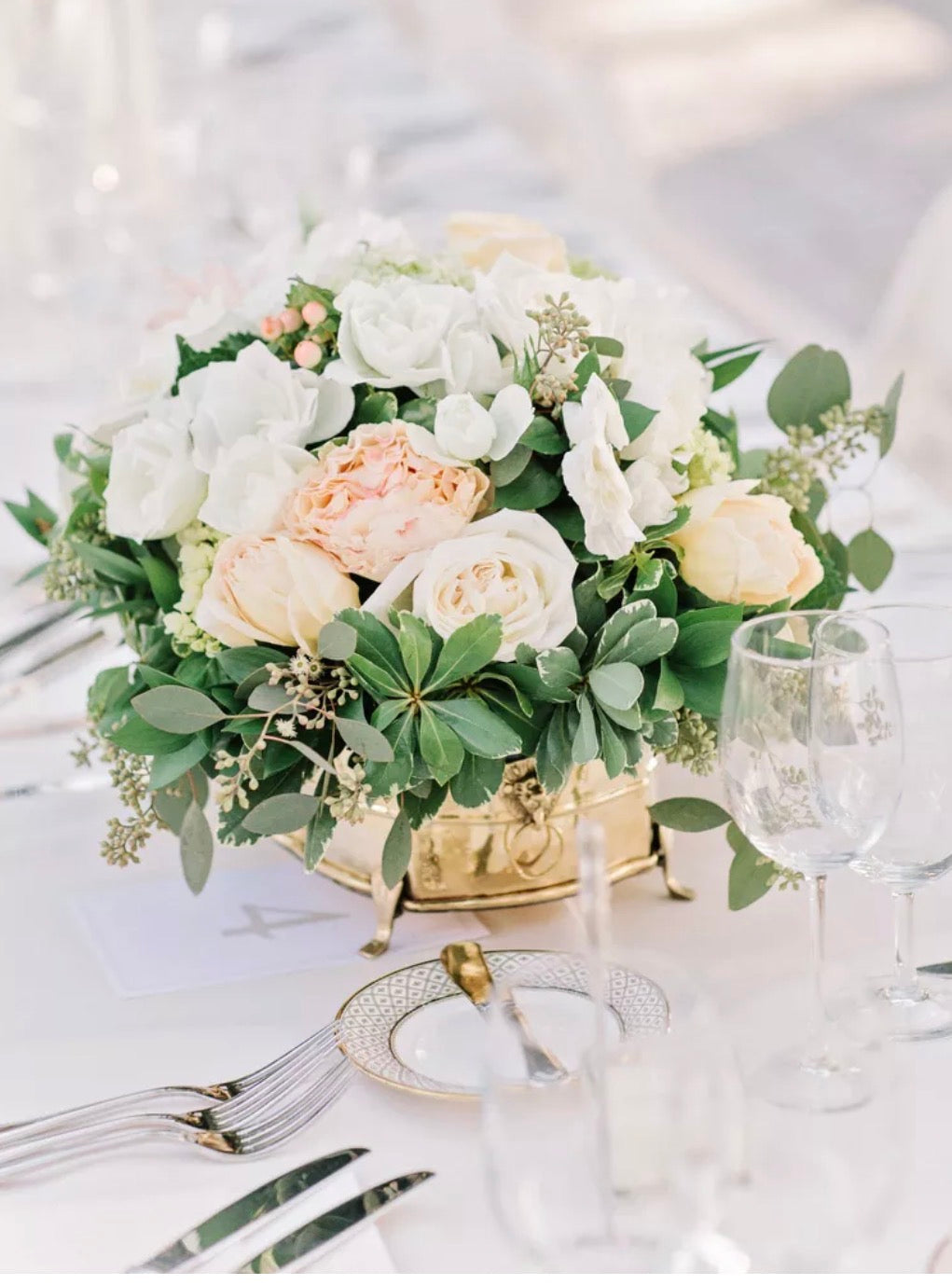 Pastel rose and greenery wedding floral arrangement by Bloom and Petals